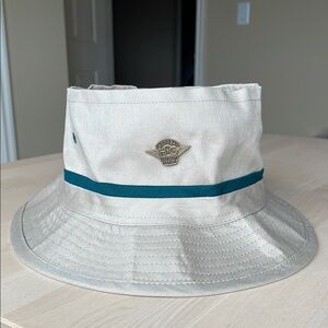 Beige Bucket Hat with Teal Stripe and “Ladies of Harley” 2002 Pin